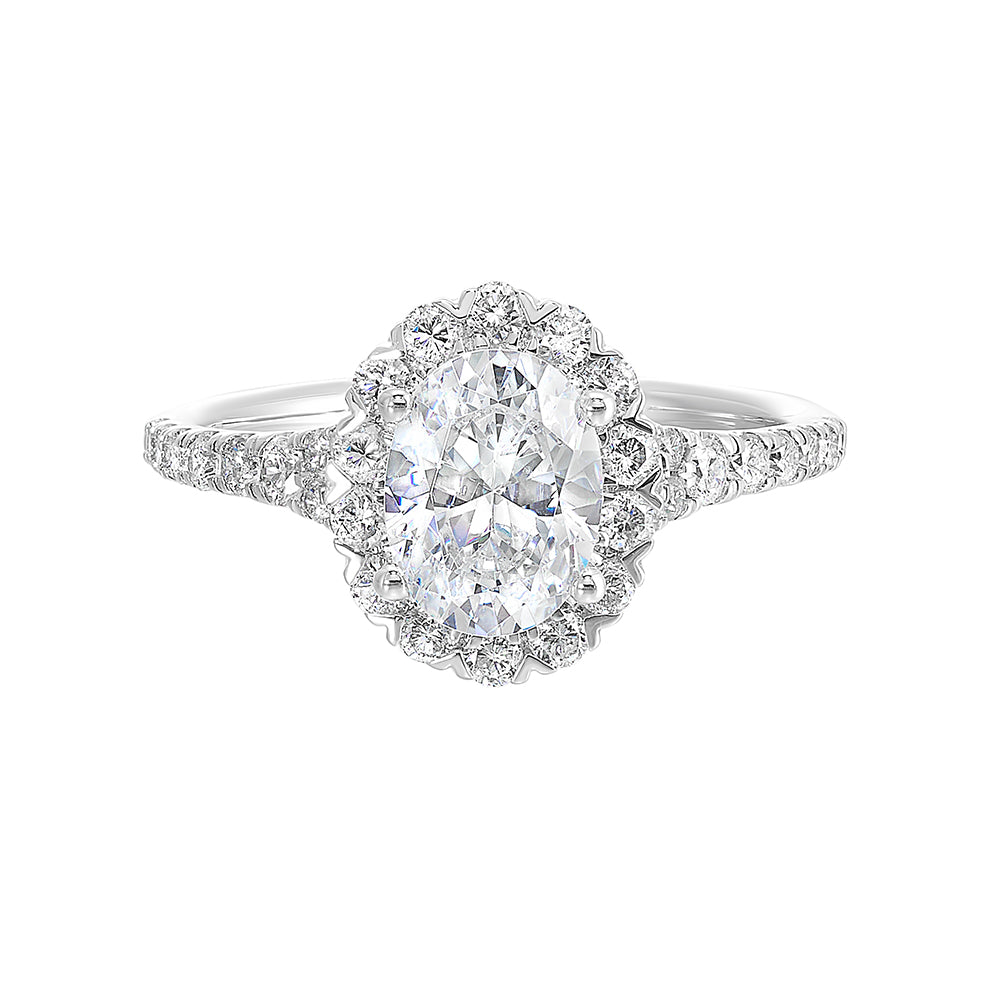 This breathtaking engagement ring combines classic and modern styles with a dazzling oval center and halo followed by a tapered shank look.