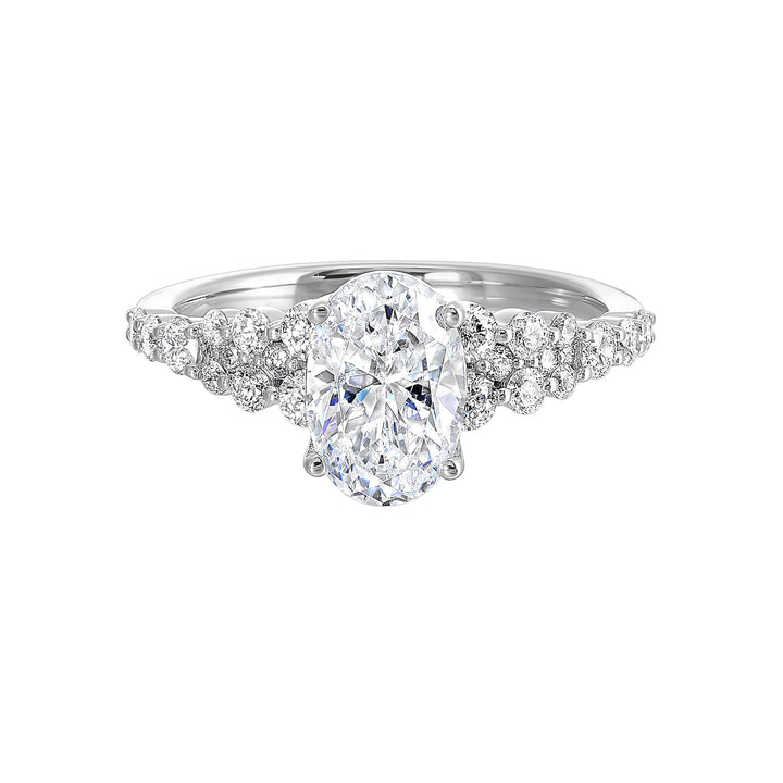 Immerse yourself in the enchanting beauty of this engagement ring highlighting the oval center and unique diamond setting in shank.