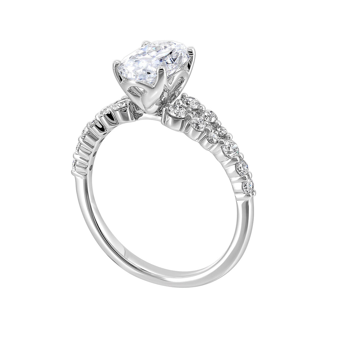 Immerse yourself in the enchanting beauty of this engagement ring highlighting the oval center and unique diamond setting in shank.