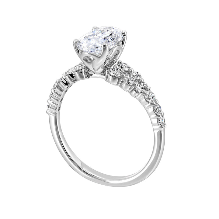 Immerse yourself in the enchanting beauty of this engagement ring highlighting the oval center and unique diamond setting in shank.