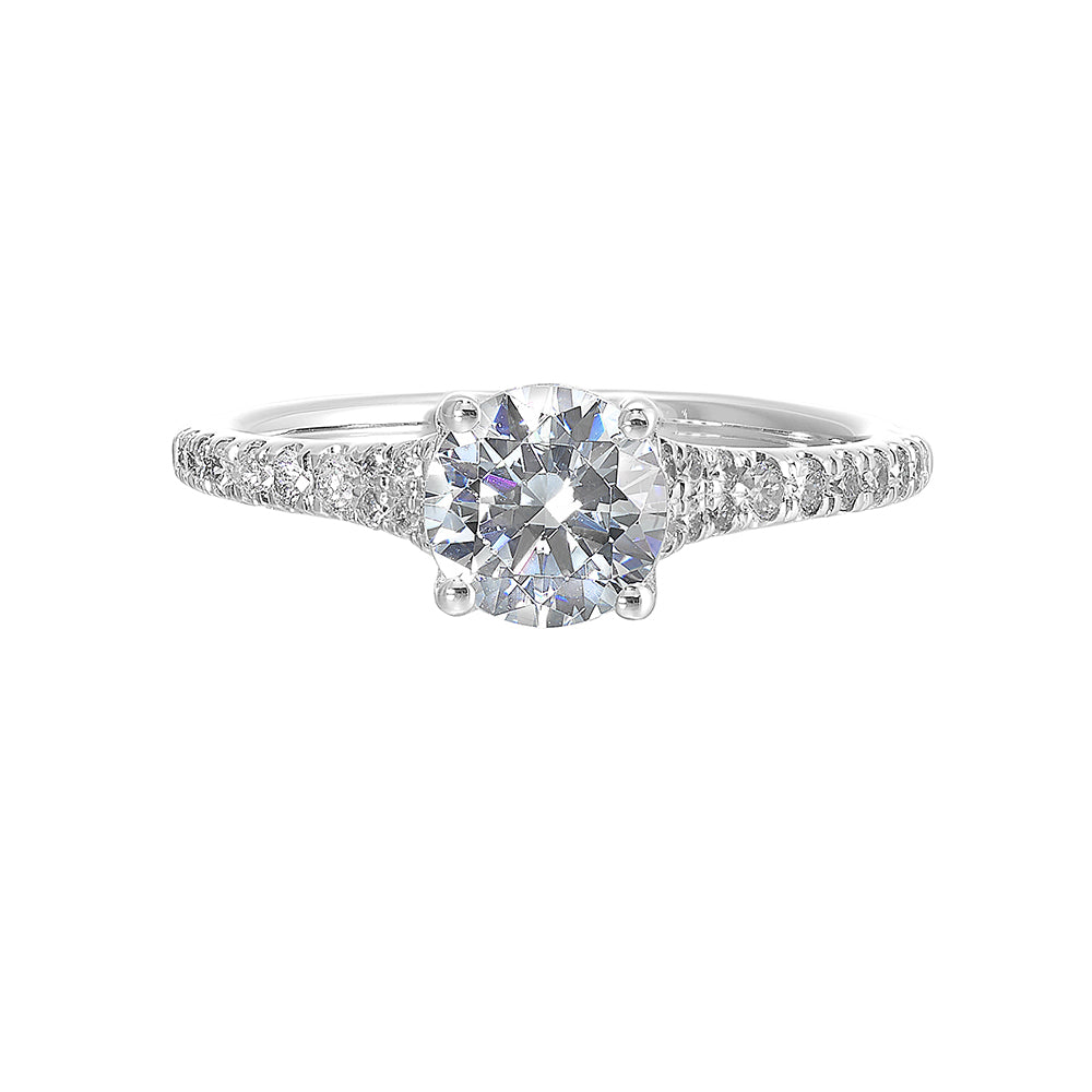 Defined by a tapered shank set with graduated round diamonds, this classic solitaire engagement ring is a classy choice