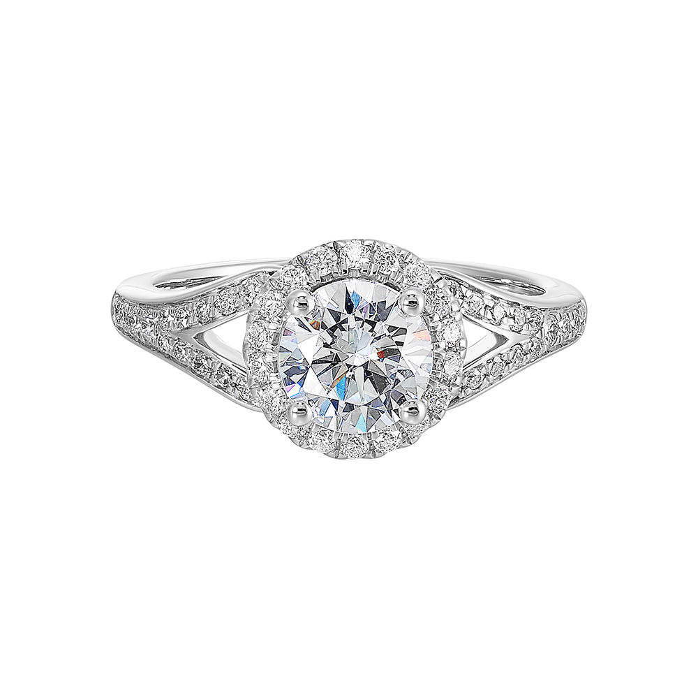 Halo engagement ring features an art deco inspired split shank design with diamond pave and glamourous round halo.
