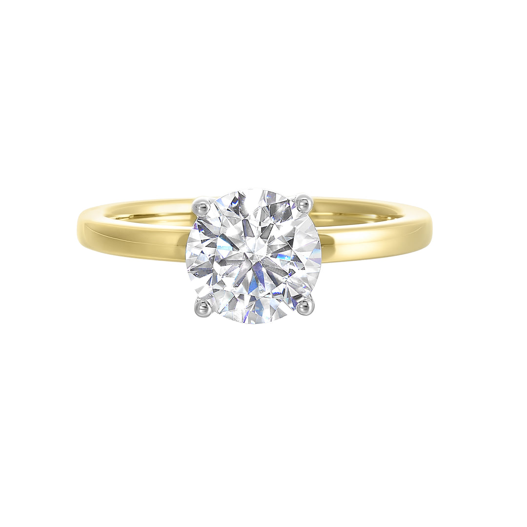 Engraved details flow towards a brilliant center solitare in this modern engagement ring.
