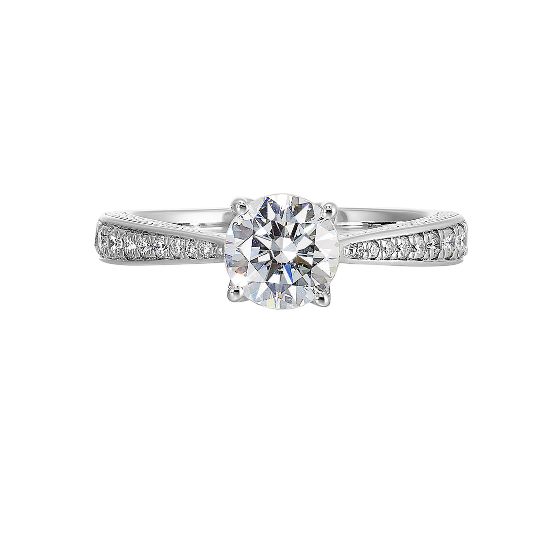 This classic solitare four prong diamond engagement ring features a reverse pave tapered shank accented with front details.