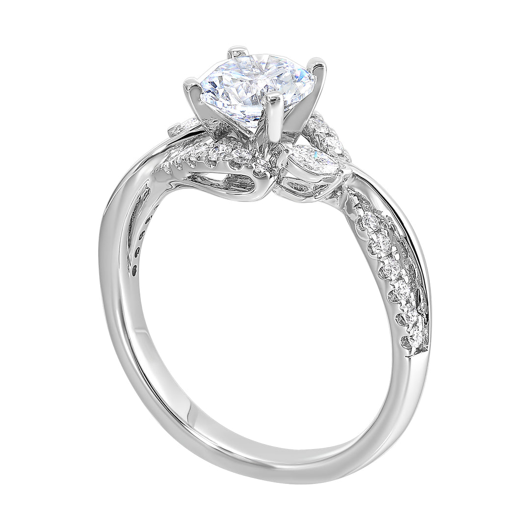 A nature inspired twist on the classic three stone ring. This ring features interwined look with play of pave diamonds and metal.