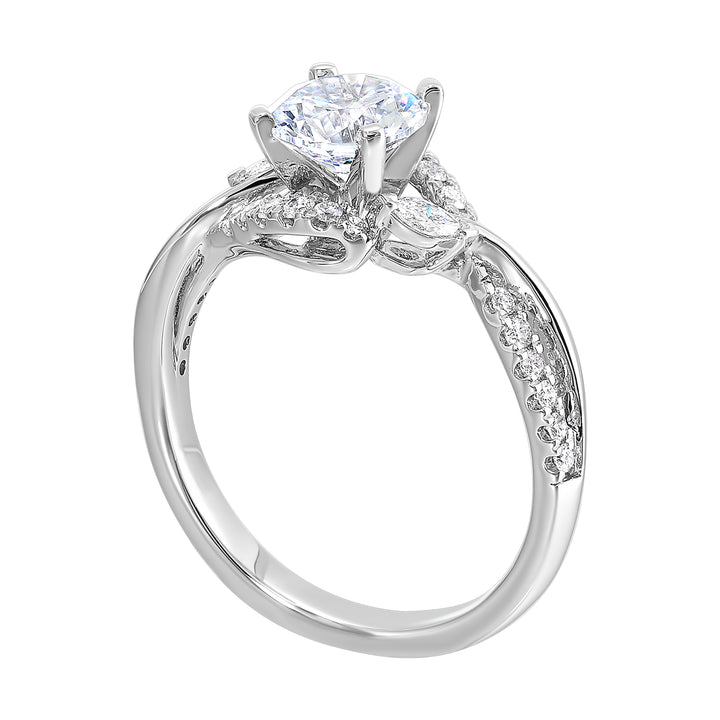 A nature inspired twist on the classic three stone ring. This ring features interwined look with play of pave diamonds and metal.