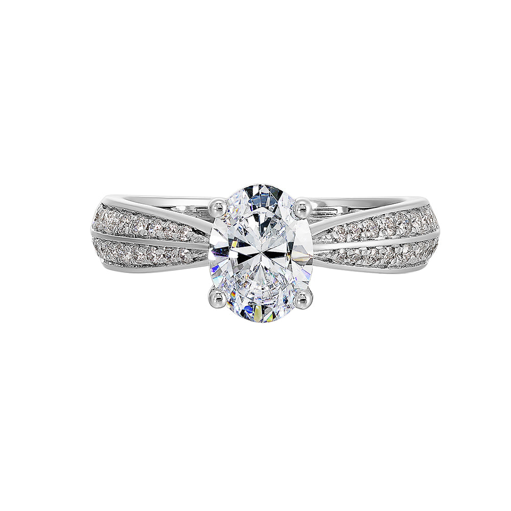 Pave set knife edge engagement ring with oval solitaire creates an elegant look with minimalist appeal.
