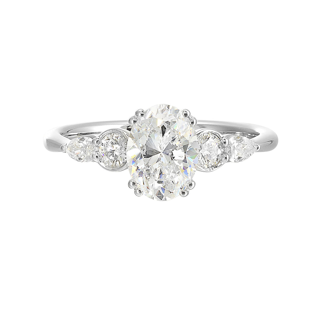 Classic five stone ring features round and pear diamonds that rest on either side of the round center diamond with a pinched shank for an elegant yet modern look.