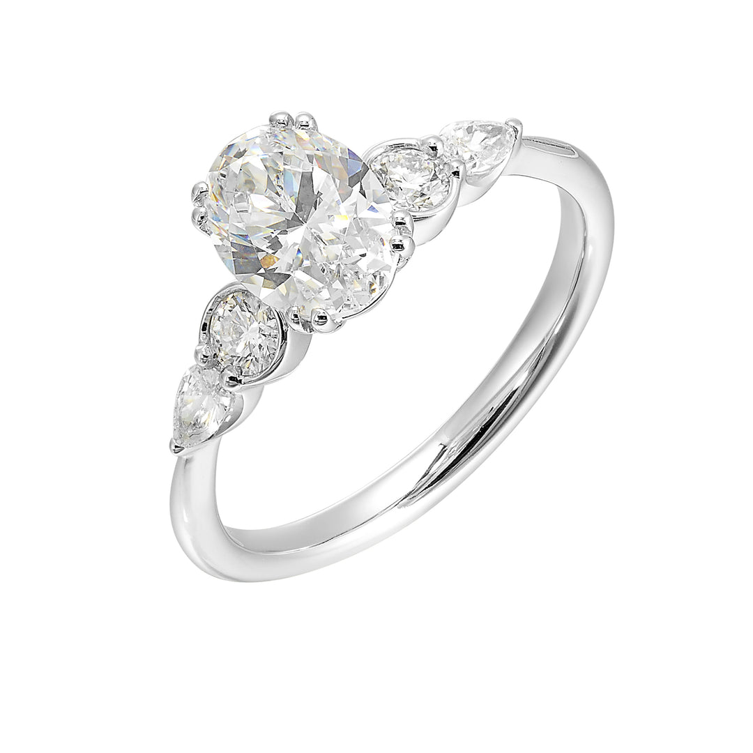 Classic five stone ring features round and pear diamonds that rest on either side of the round center diamond with a pinched shank for an elegant yet modern look.
