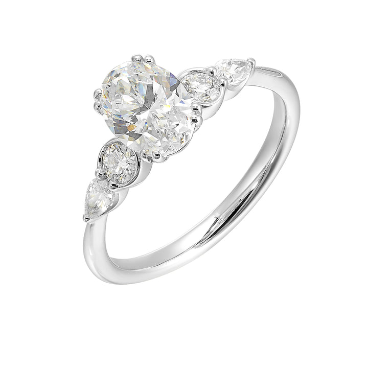 Classic five stone ring features round and pear diamonds that rest on either side of the round center diamond with a pinched shank for an elegant yet modern look.
