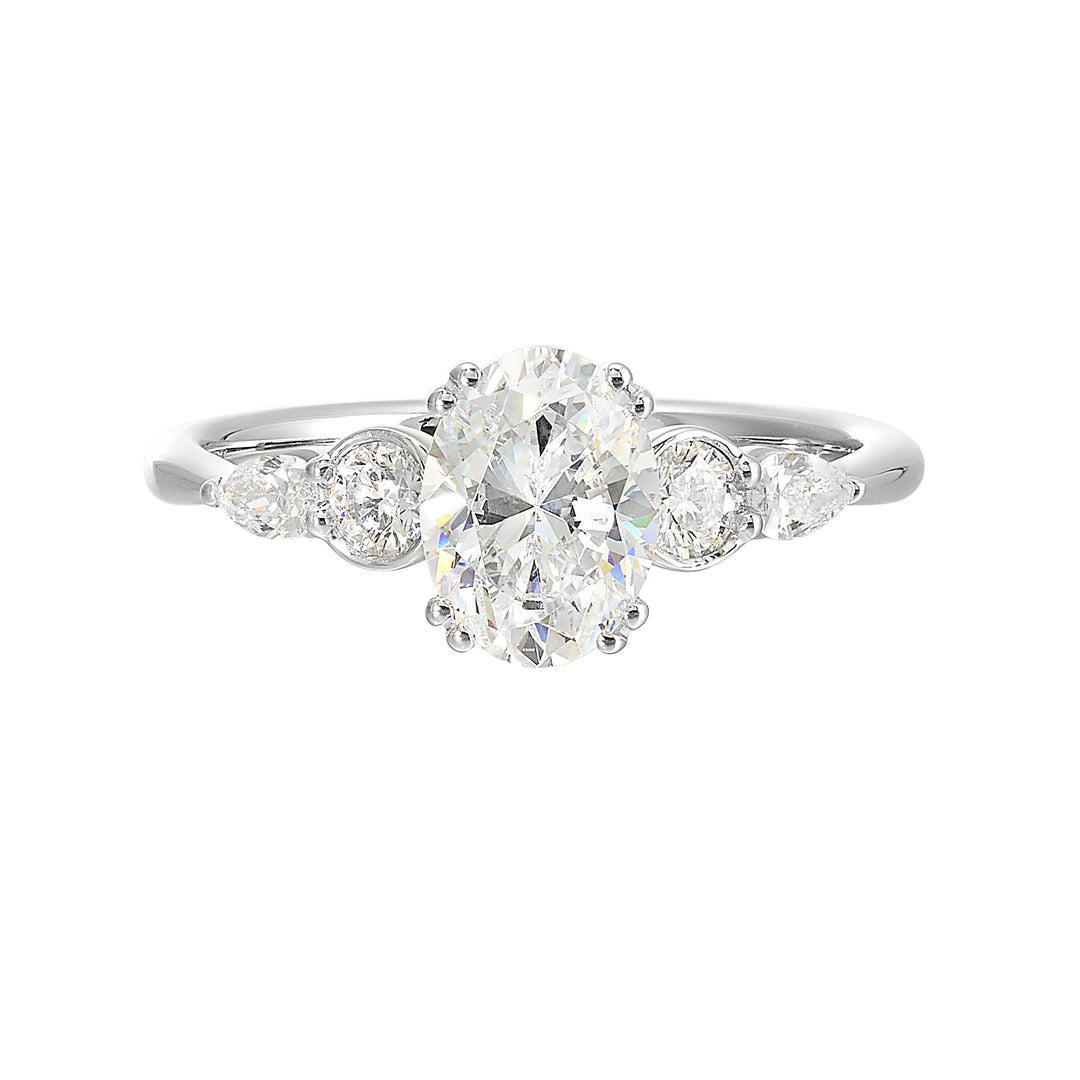 Classic five stone ring features round and pear diamonds that rest on either side of the round center diamond with a pinched shank for an elegant yet modern look.
