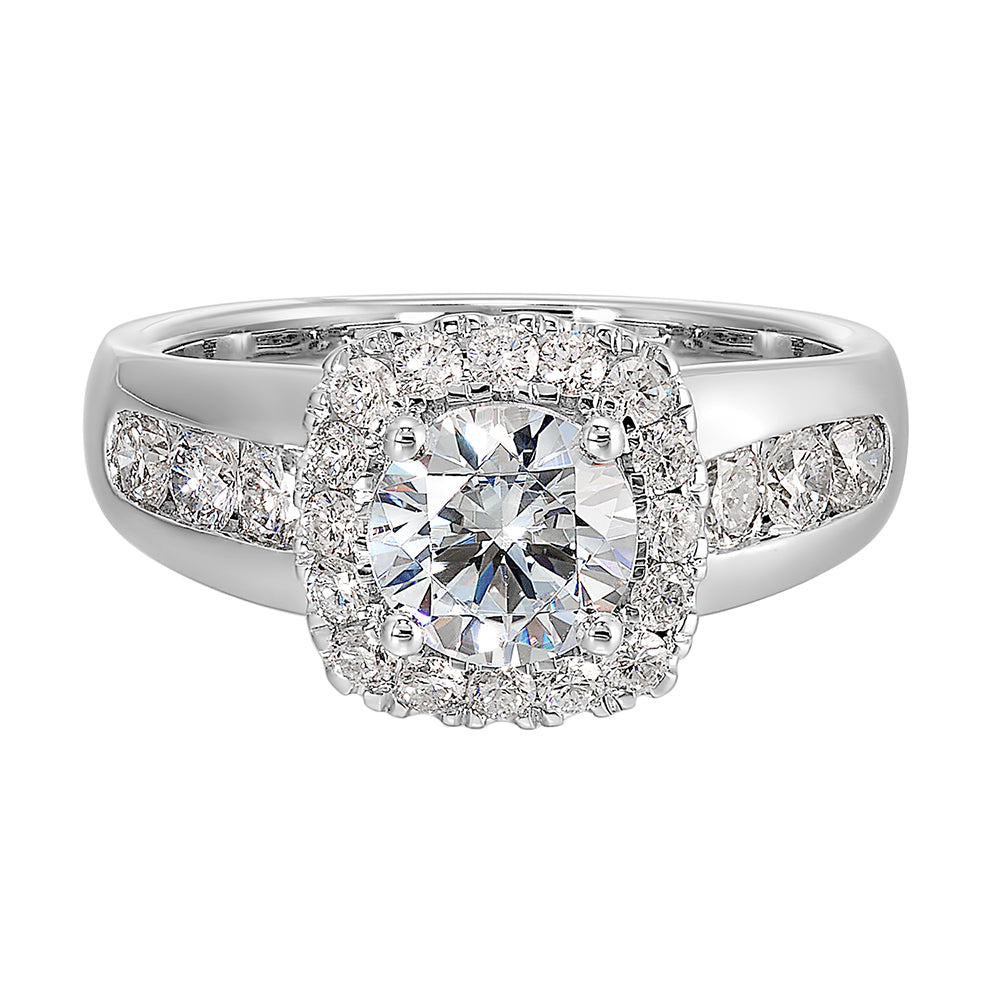 Channel set diamonds wrap this glamorous ring with an addition of cushion halo and solitaire center.