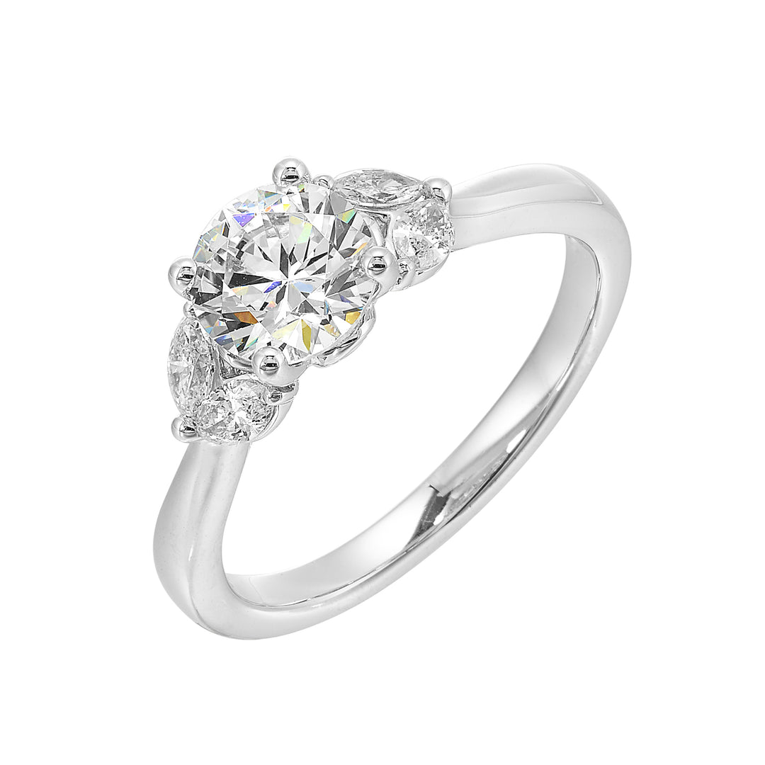 Create timeless romance with round solitaire engagement ring held between symmetrical marquise petals.