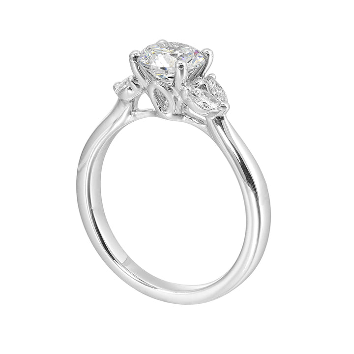 Create timeless romance with round solitaire engagement ring held between symmetrical marquise petals.