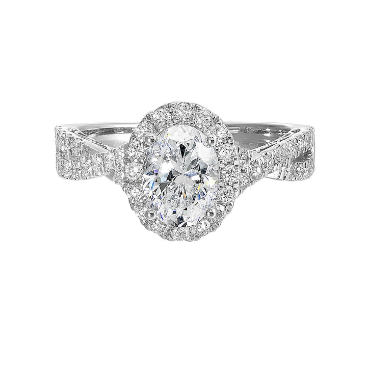 Shimmers of entwined shank with a classic halo and round center diamond is sure to delight you.