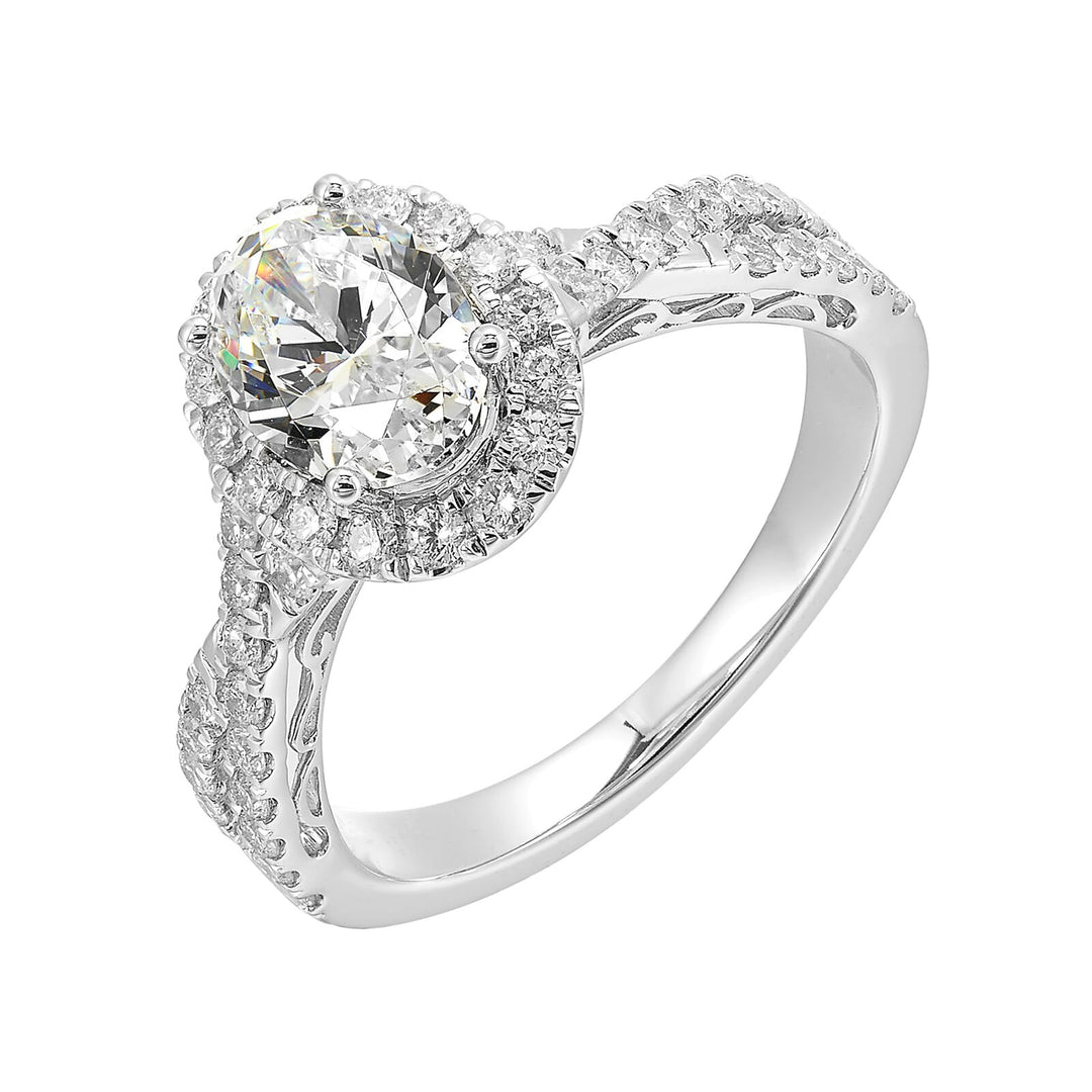 Shimmers of entwined shank with a classic halo and round center diamond is sure to delight you.