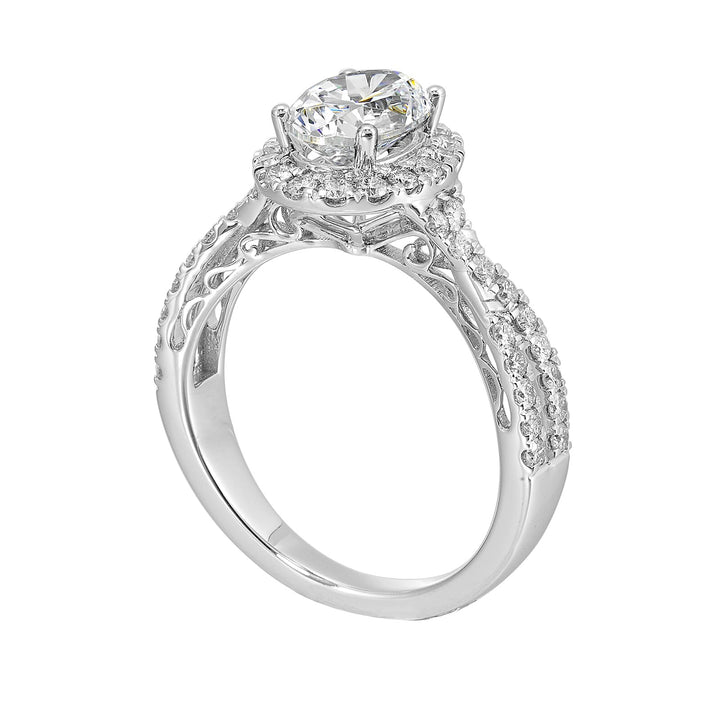 Shimmers of entwined shank with a classic halo and round center diamond is sure to delight you.