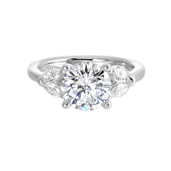Contemporary style engagement ring features marquise set diamond on the band shoulder highlighting the center solitare.