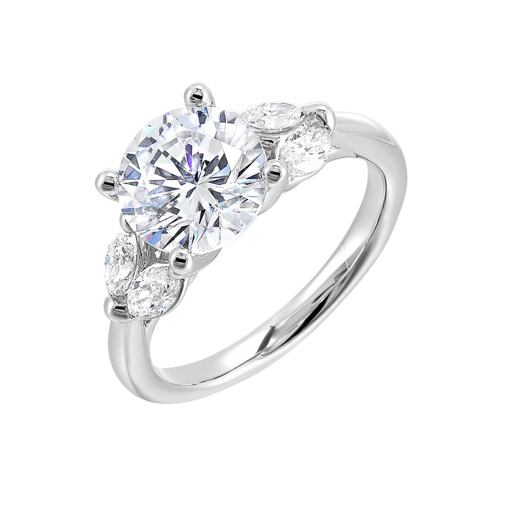 Contemporary style engagement ring features marquise set diamond on the band shoulder highlighting the center solitare.