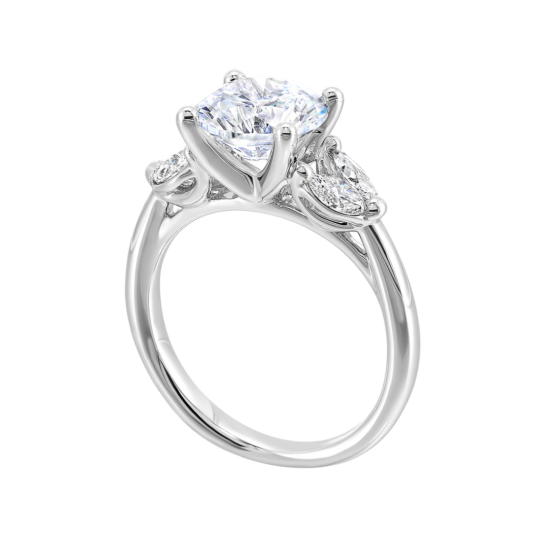 Contemporary style engagement ring features marquise set diamond on the band shoulder highlighting the center solitare.
