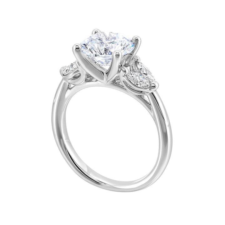 Contemporary style engagement ring features marquise set diamond on the band shoulder highlighting the center solitare.
