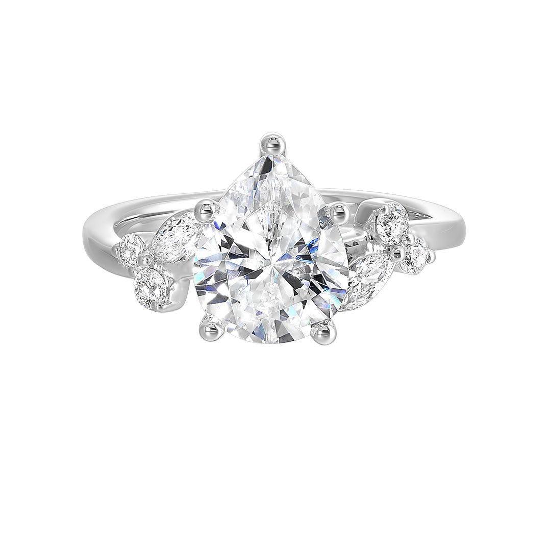 Timeless pear cut engagement ring features marquise and round diamonds placed randomly are perfect for her special day.