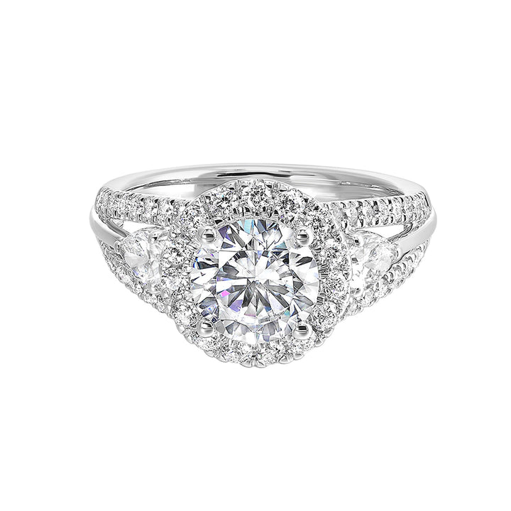 Start your love story with sparkles of this marquise and round diamond three stone engagement ring. The three rows shank have a beautiful split with pave studded diamonds on the sides.