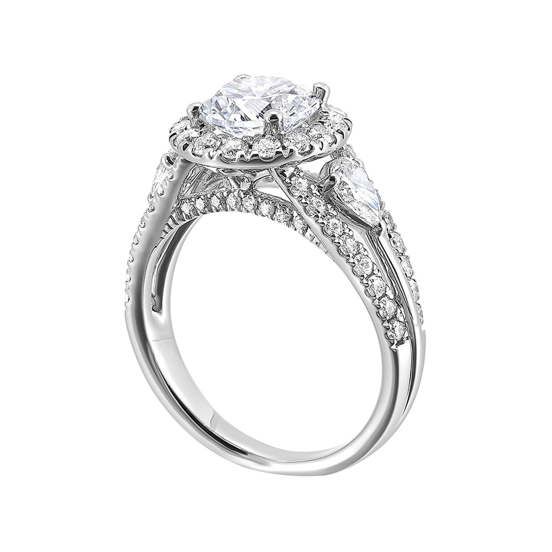 Start your love story with sparkles of this marquise and round diamond three stone engagement ring. The three rows shank have a beautiful split with pave studded diamonds on the sides.