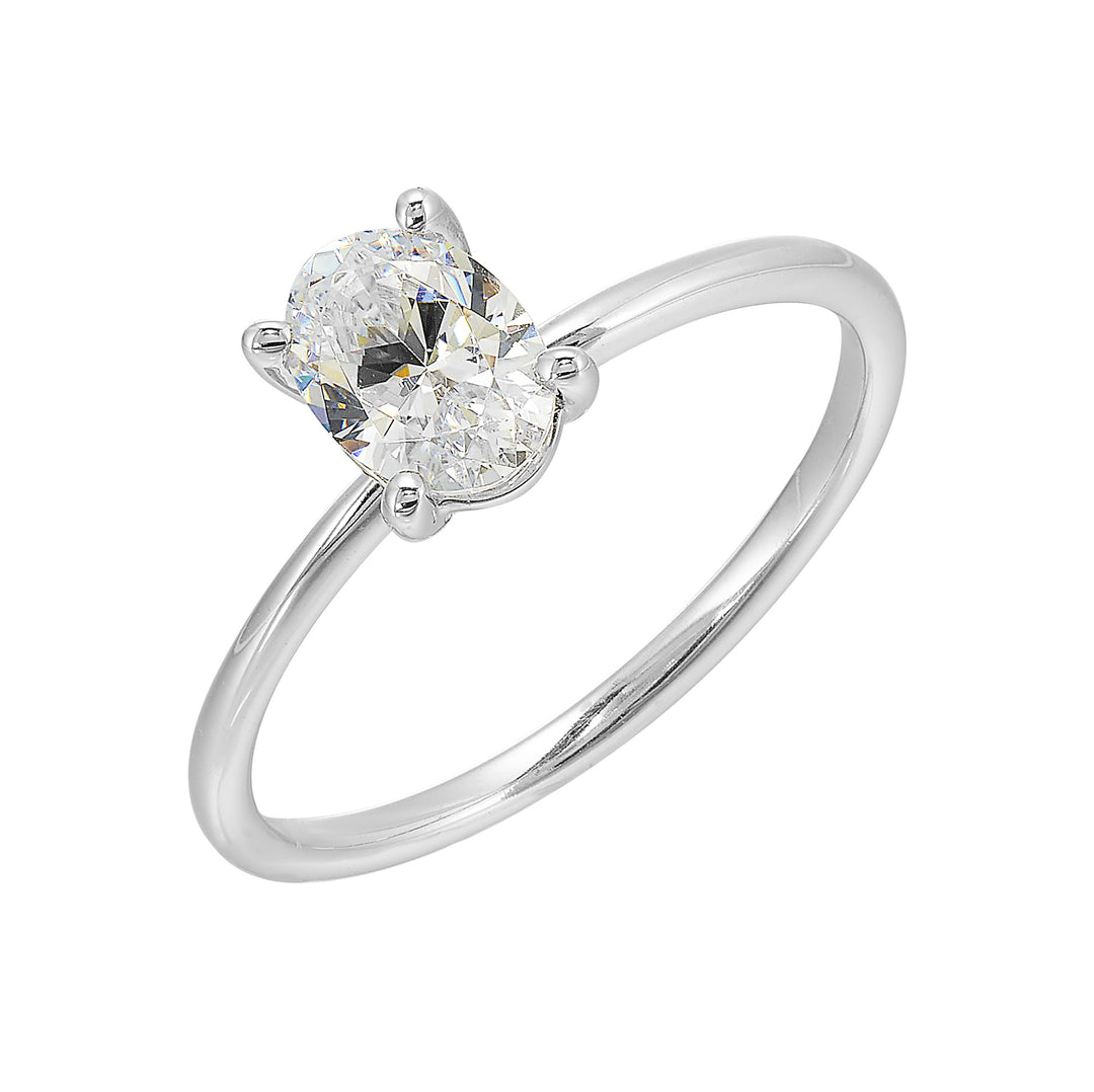 This delightful engagement ring features classic four prong oval solitaire engagement ring. The petite band adds to the sleek, classic look of this ring.