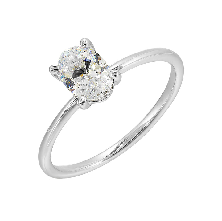 This delightful engagement ring features classic four prong oval solitaire engagement ring. The petite band adds to the sleek, classic look of this ring.