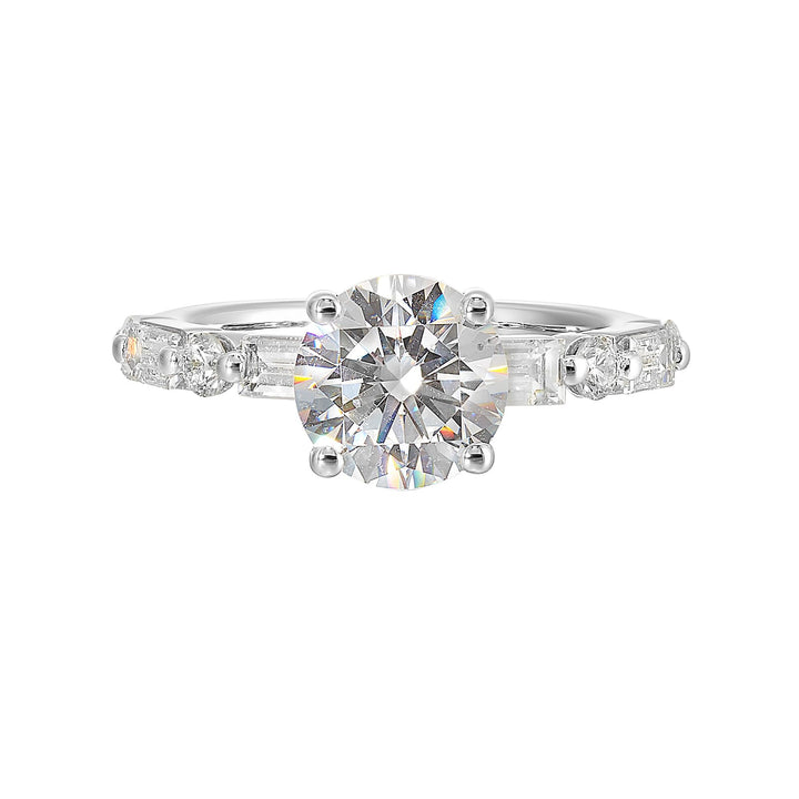 Baguettes and round diamonds spell contemporary elegance along this solitaire engagement ring.