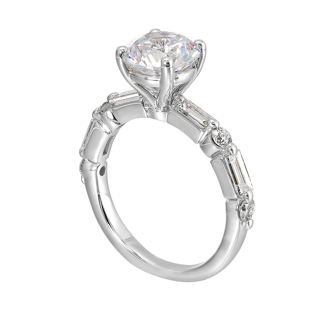 Baguettes and round diamonds spell contemporary elegance along this solitaire engagement ring.