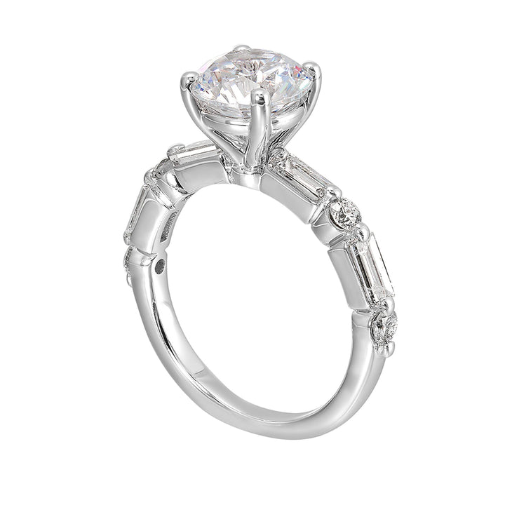 Baguettes and round diamonds spell contemporary elegance along this solitaire engagement ring.