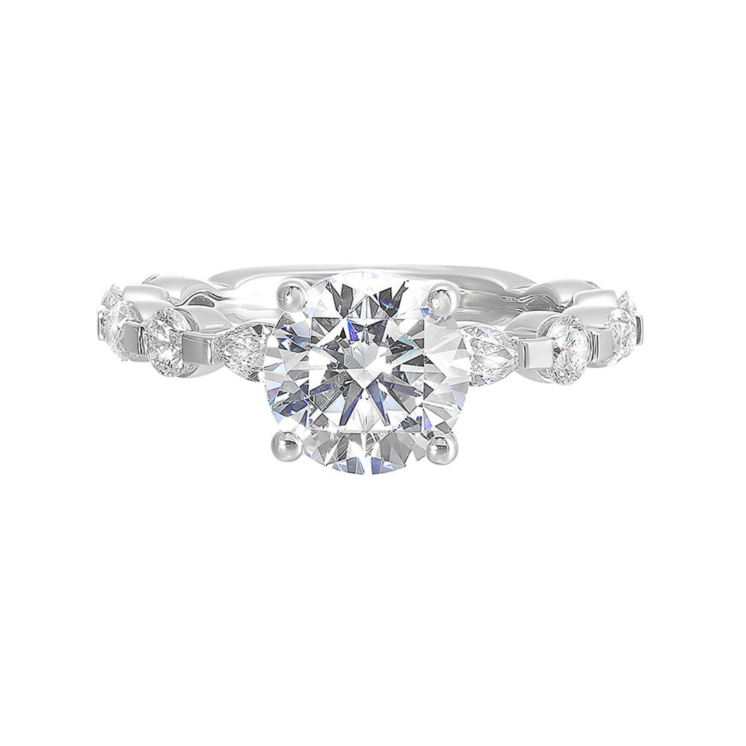 This engagement ring featues a sparkling round centre, with alternating marquise and round brilliant diamonds in the band.