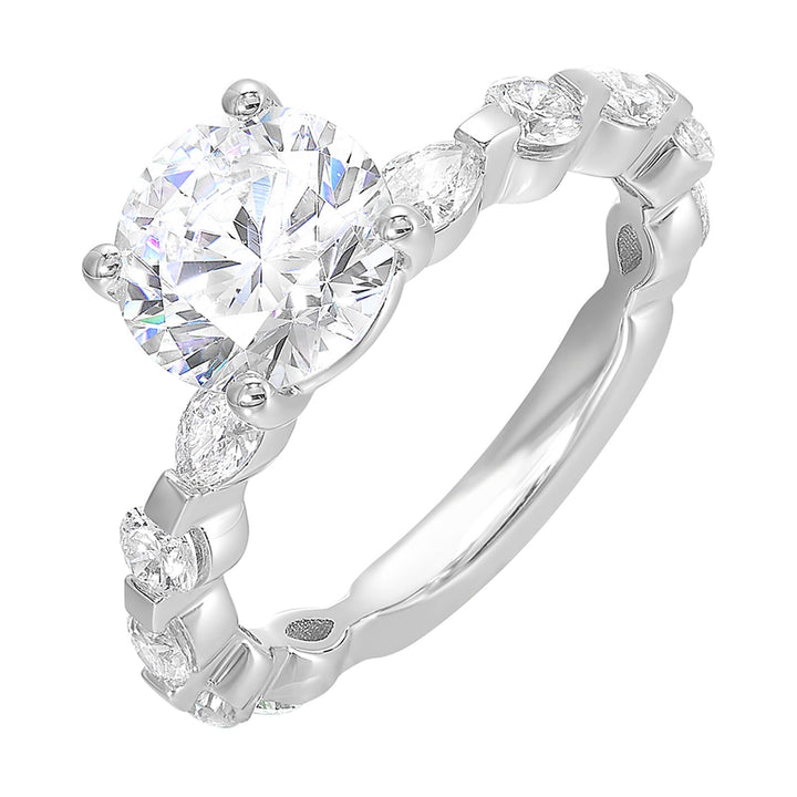 This engagement ring featues a sparkling round centre, with alternating marquise and round brilliant diamonds in the band.