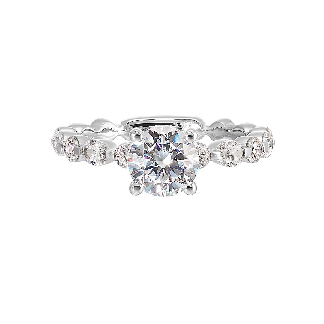 This trendy engagement ring features single prong diamonds set along the shank with stunning solitaire in center.