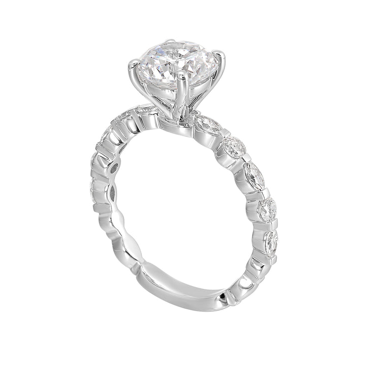 You are sure to cause a sensation with marqusie and round diamonds engagement ring highlighting the center solitaire.