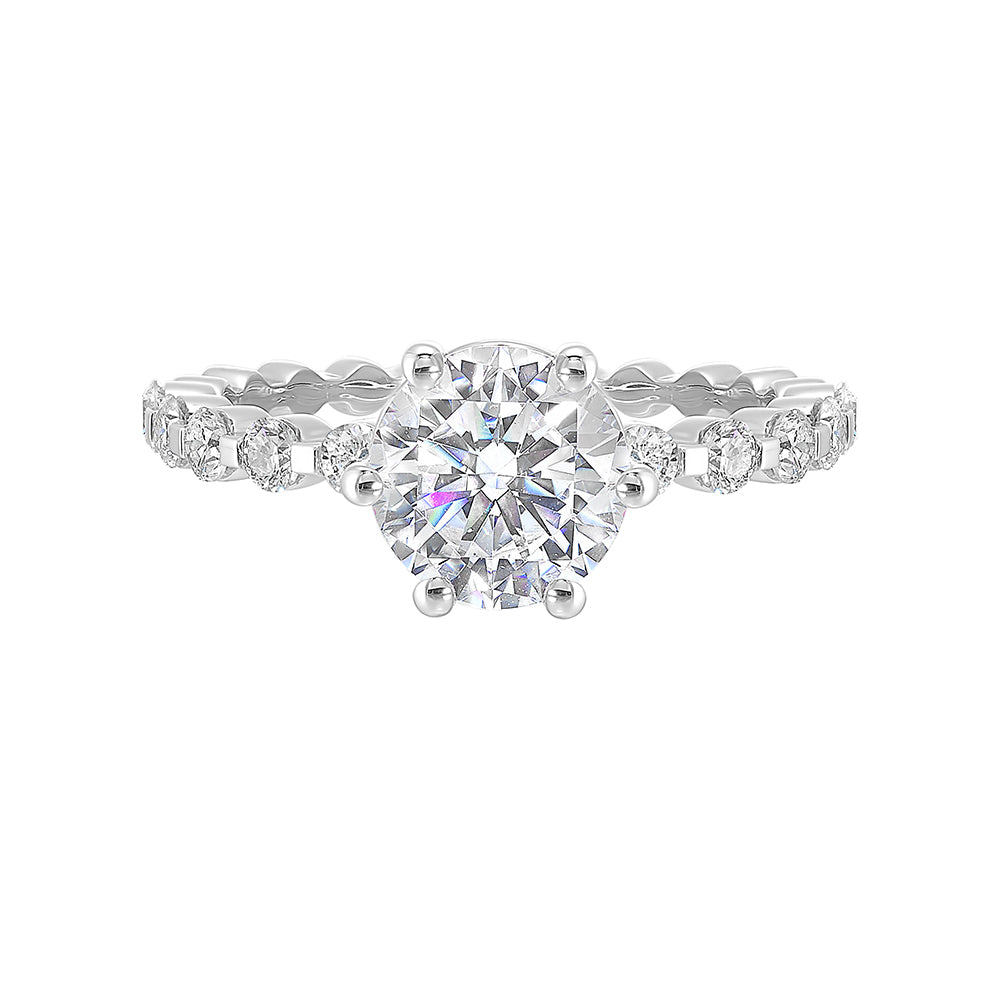 Clean and elegant with diamonds set in a single common prong along the shank shows off perfectly the center diamond set in 6 prong.