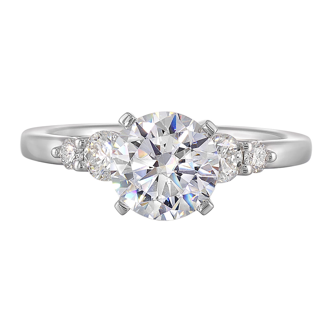 Five times diamonds for five times sparkles. A classic, lustrous band completes the look of this five stone engagement ring.