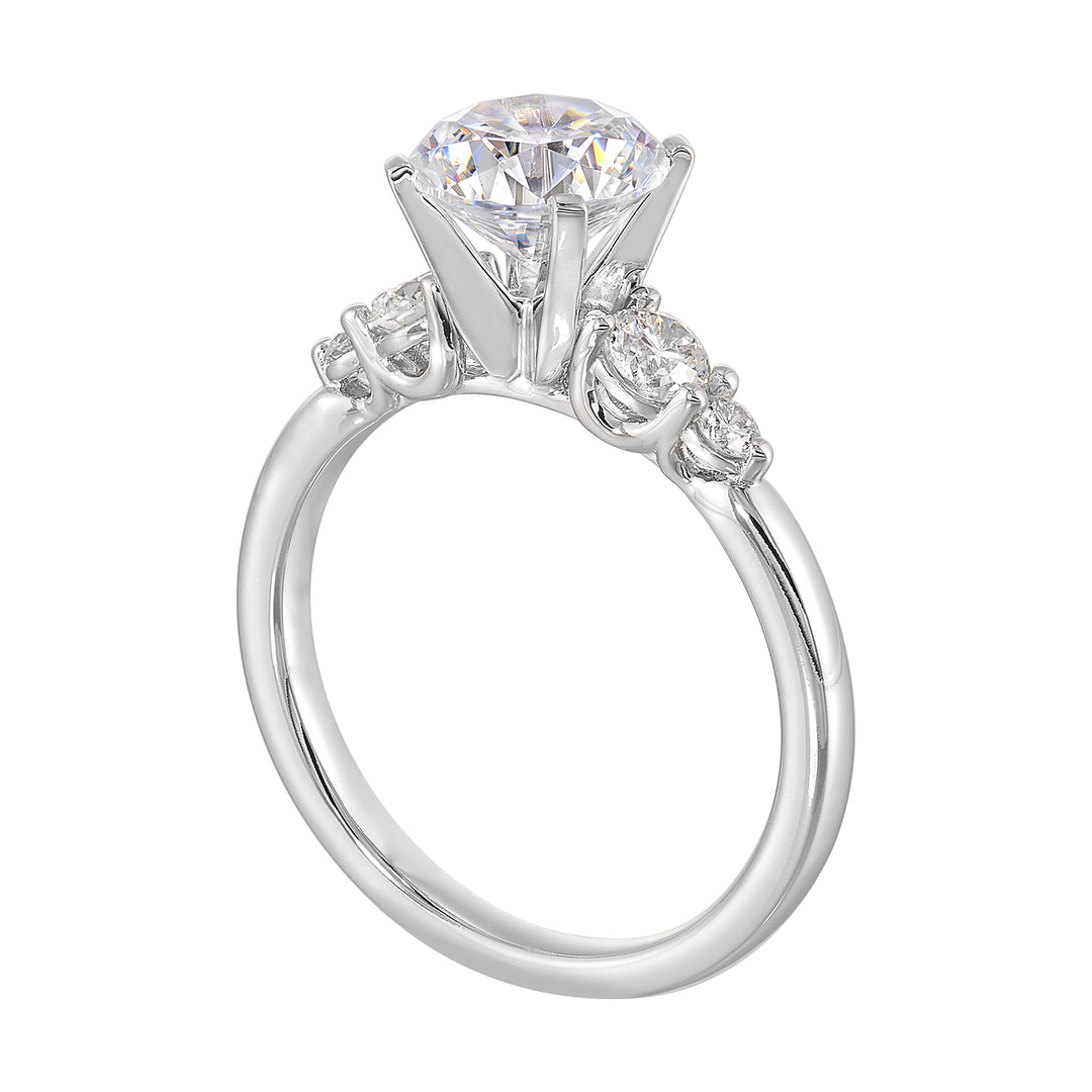 Five times diamonds for five times sparkles. A classic, lustrous band completes the look of this five stone engagement ring.