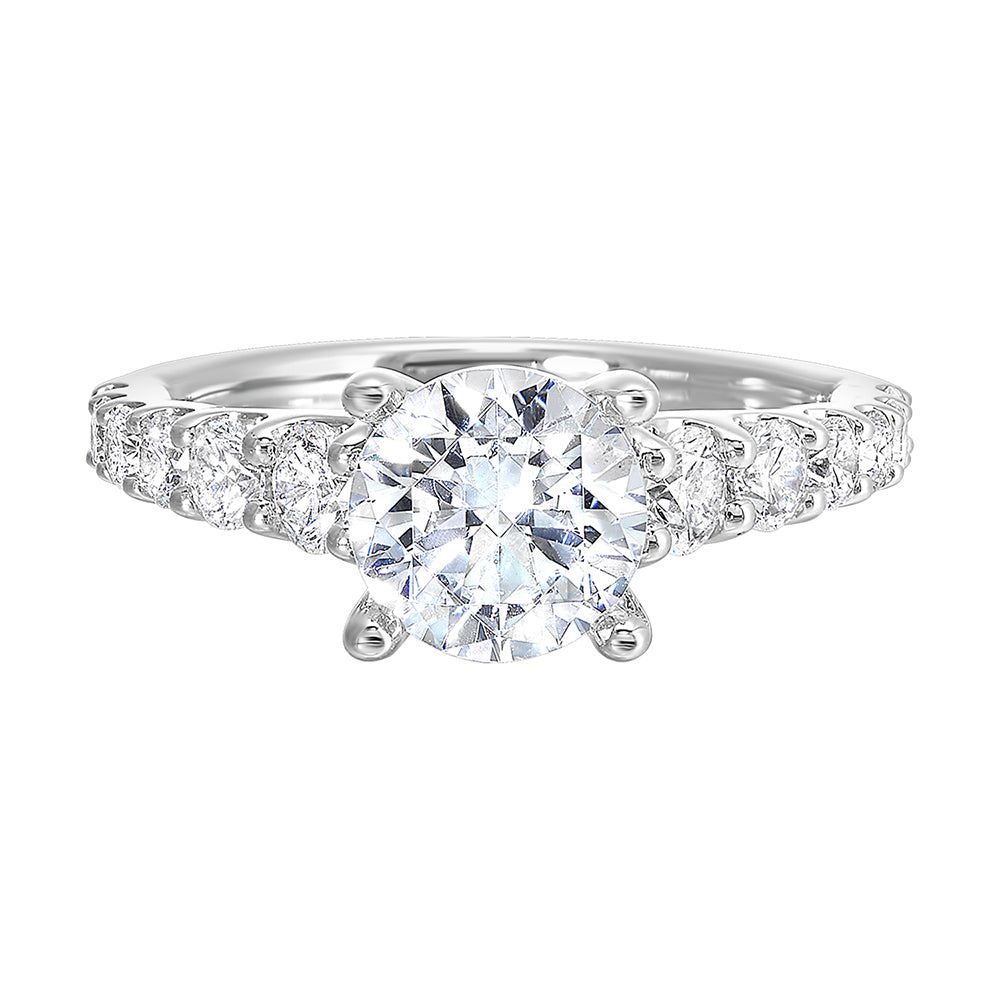 Dazzle with this gorgeous engagement ring featuring a round diamond center.  The shank is graduated with large round diamonds, set in shared prongs.