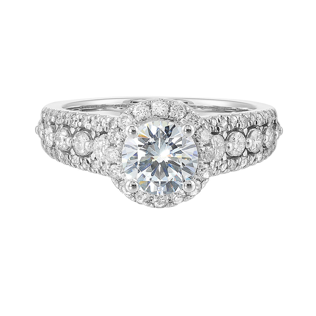 Halo shines with a stunning solitaire, embraced by luxurious three row shank tappering towards the bottom consisting of bigger diamonds in the center row is sure of a stunner.