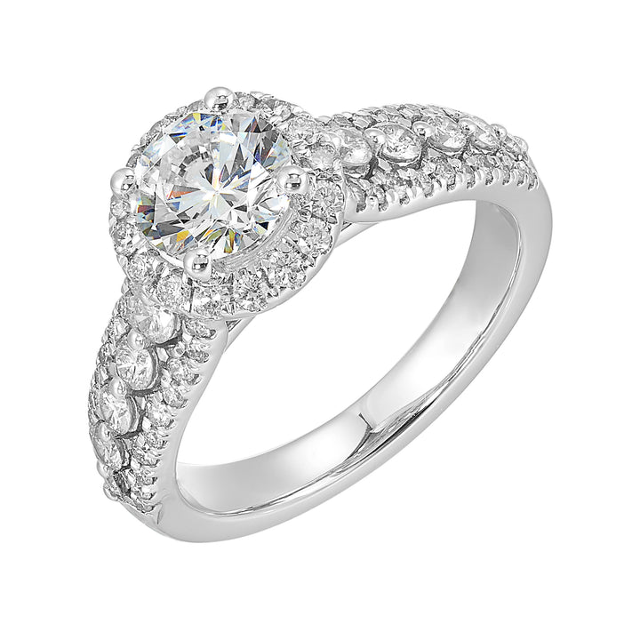 Halo shines with a stunning solitaire, embraced by luxurious three row shank tappering towards the bottom consisting of bigger diamonds in the center row is sure of a stunner.