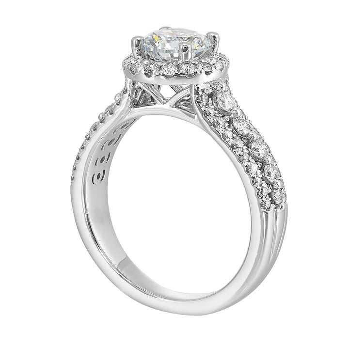 Halo shines with a stunning solitaire, embraced by luxurious three row shank tappering towards the bottom consisting of bigger diamonds in the center row is sure of a stunner.