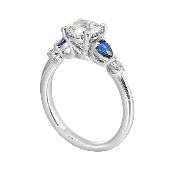 Colourful celebration! This five stone ring features round solitaire diamonds followed by pear shape colorstone and a round diamond at the end, offers a touch of color to your personality.