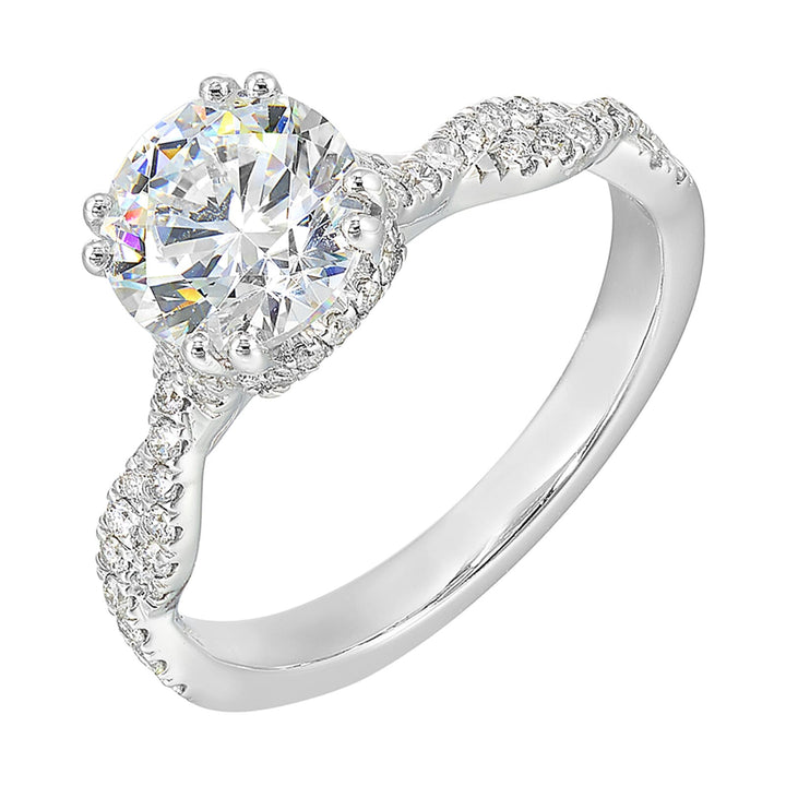 Stunning with a round solitaire diamond set in dual prongs atop a modern crisscross band. The unique twist on timeless elegance is perfect for the modern bride.