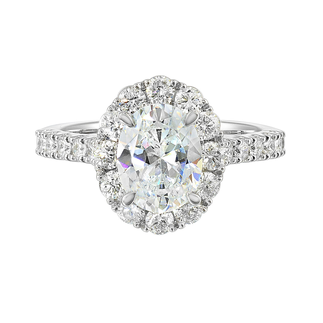 Featuring a mesmerizing floral halo around the solitaire diamond adorned with sparkling diamonds on the shank is perfect for the classic you.