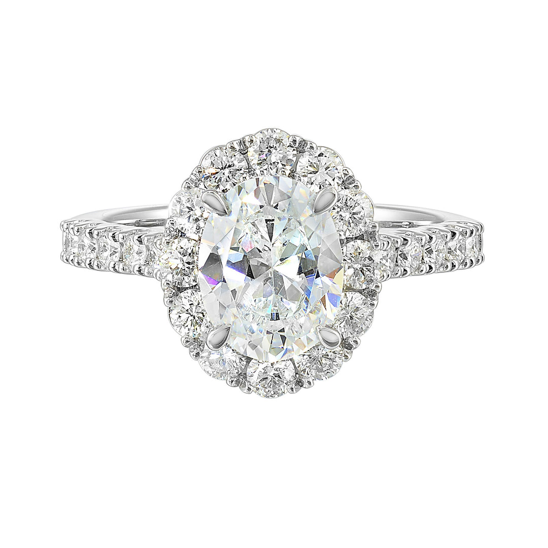 Featuring a mesmerizing floral halo around the solitaire diamond adorned with sparkling diamonds on the shank is perfect for the classic you.