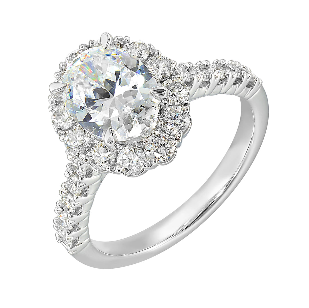 Featuring a mesmerizing floral halo around the solitaire diamond adorned with sparkling diamonds on the shank is perfect for the classic you.