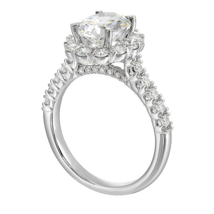 Featuring a mesmerizing floral halo around the solitaire diamond adorned with sparkling diamonds on the shank is perfect for the classic you.